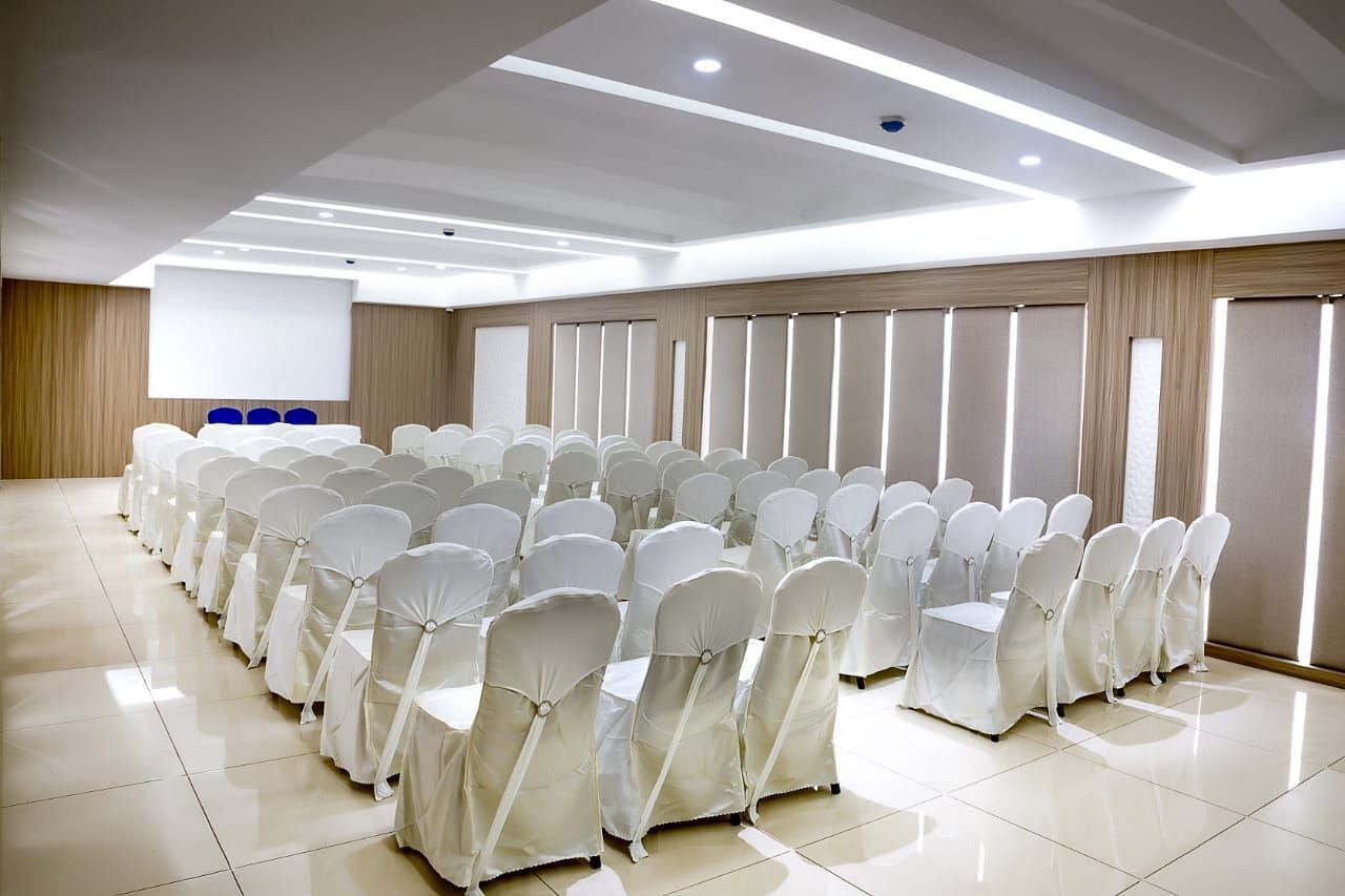 V Square Hall at Mayberry Tiruppur with chairs neatly arranged and good lighting throughout the space